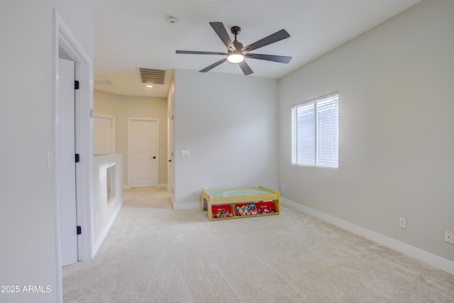 playroom featuring carpet, visible vents, baseboards, and ceiling fan