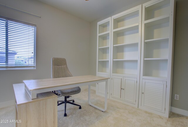 home office featuring carpet floors and baseboards