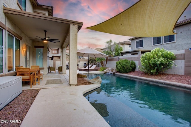view of swimming pool with a fenced in pool, a patio, a fenced backyard, and ceiling fan