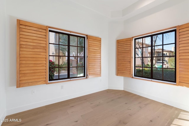 spare room with light wood-type flooring