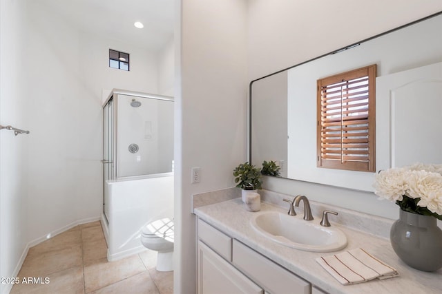 bathroom with a shower with door, tile patterned floors, vanity, and toilet