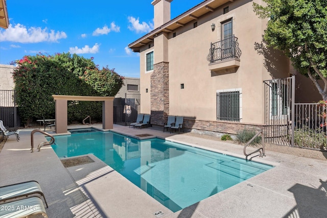 view of pool featuring a patio