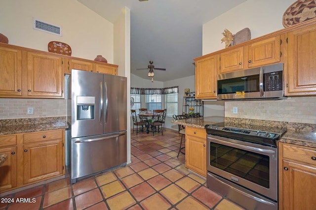 kitchen featuring appliances with stainless steel finishes, tasteful backsplash, ceiling fan, high vaulted ceiling, and light tile patterned flooring