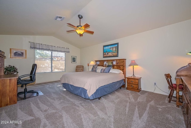 carpeted bedroom with ceiling fan and vaulted ceiling