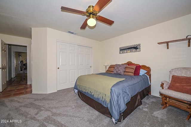 bedroom with carpet flooring, ceiling fan, and a closet