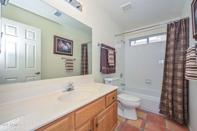 full bathroom with tile patterned flooring, vanity, shower / bath combo, and toilet