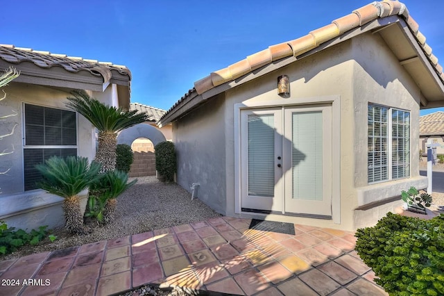 doorway to property with a patio area