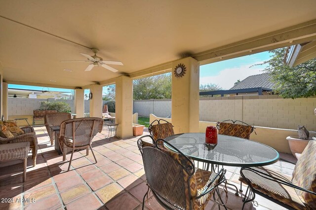 view of patio / terrace featuring ceiling fan