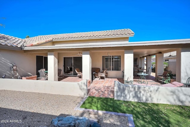 rear view of house featuring a patio