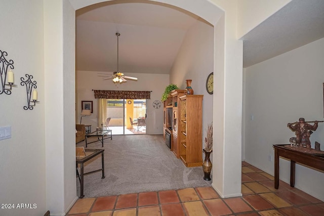 corridor with carpet flooring and lofted ceiling