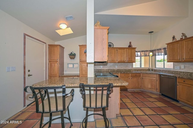 kitchen featuring a kitchen breakfast bar, decorative backsplash, sink, and stainless steel dishwasher