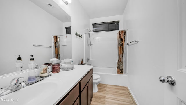11742 W Chase Ln, Avondale, AZ 85323 - bathroom featuring vanity, toilet, shower / tub combo with curtain, and wood finished floors