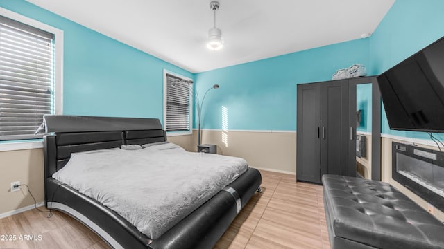 11742 W Chase Ln, Avondale, AZ 85323 - bedroom featuring multiple windows and baseboards