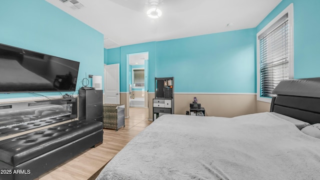 11742 W Chase Ln, Avondale, AZ 85323 - bedroom with wood finished floors and connected bathroom