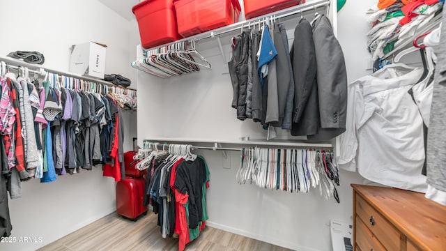 11742 W Chase Ln, Avondale, AZ 85323 - walk in closet featuring wood finished floors