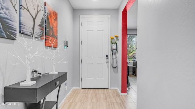 11742 W Chase Ln, Avondale, AZ 85323 - entryway featuring baseboards and light tile patterned flooring