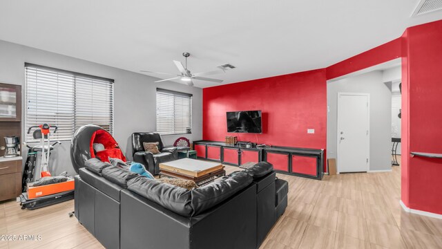 11742 W Chase Ln, Avondale, AZ 85323 - living room featuring ceiling fan and baseboards