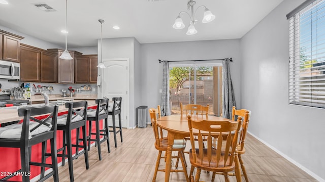 11742 W Chase Ln, Avondale, AZ 85323 - dining space with a chandelier, baseboards, and recessed lighting