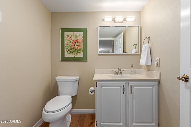10330 W Thunderbird Blvd Unit A301, Sun City, AZ 85351 - bathroom featuring vanity, toilet, wood finished floors, and baseboards