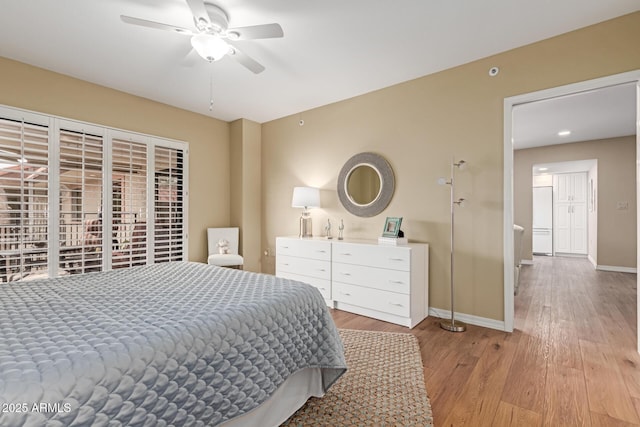 10330 W Thunderbird Blvd Unit A301, Sun City, AZ 85351 - bedroom featuring wood finished floors, baseboards, and a ceiling fan