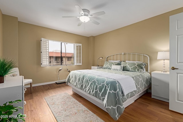 10330 W Thunderbird Blvd Unit A301, Sun City, AZ 85351 - bedroom featuring wood finished floors, baseboards, and ceiling fan