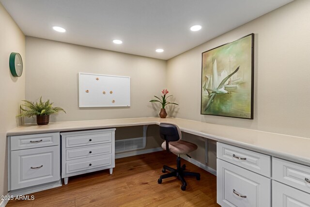 10330 W Thunderbird Blvd Unit A301, Sun City, AZ 85351 - home office with built in study area, light wood finished floors, and recessed lighting