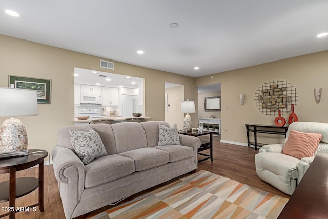 10330 W Thunderbird Blvd Unit A301, Sun City, AZ 85351 - living room with recessed lighting, light wood-style flooring, and baseboards