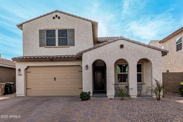 mediterranean / spanish-style house featuring a garage