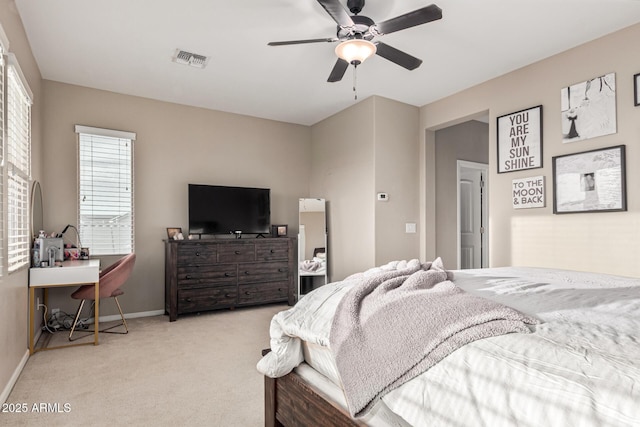 bedroom featuring ceiling fan and light carpet