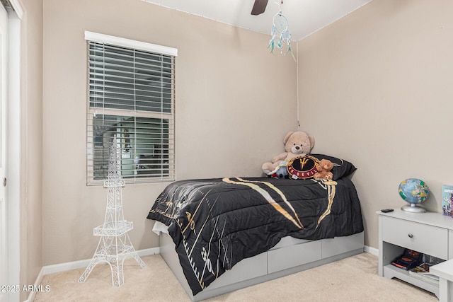 carpeted bedroom with ceiling fan