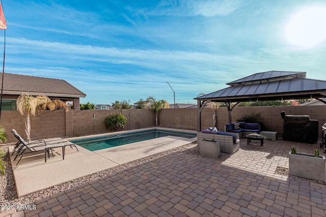 view of pool featuring a patio area, a gazebo, an outdoor hangout area, and a grill