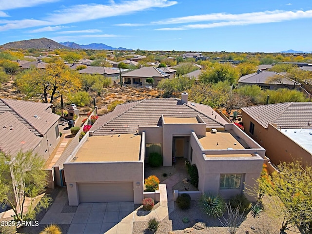 birds eye view of property with a residential view and a mountain view