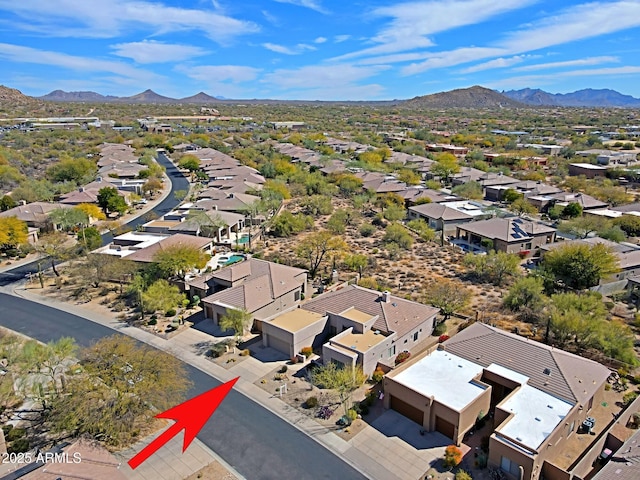 drone / aerial view with a residential view and a mountain view