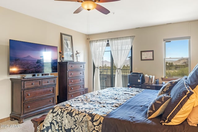 bedroom featuring carpet, access to exterior, and a ceiling fan