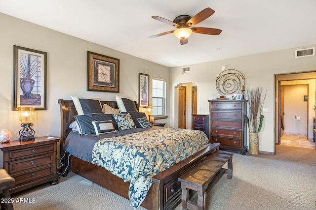 bedroom featuring carpet flooring, baseboards, visible vents, and ceiling fan