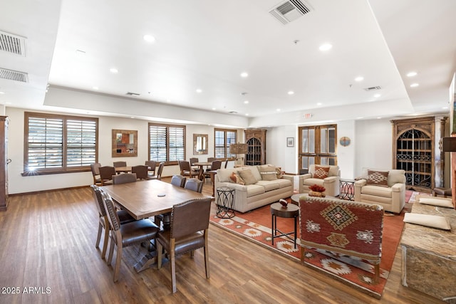 dining space featuring visible vents, recessed lighting, and wood finished floors