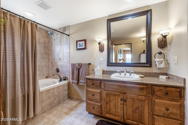 full bathroom with tile patterned floors, visible vents, vanity, and tiled shower / bath combo