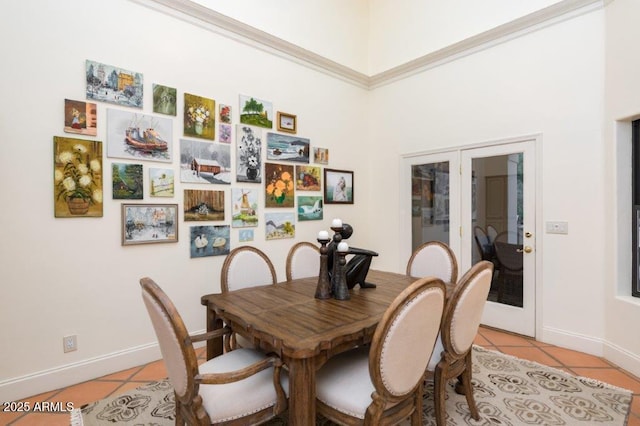 dining area featuring french doors, baseboards, and light tile patterned floors