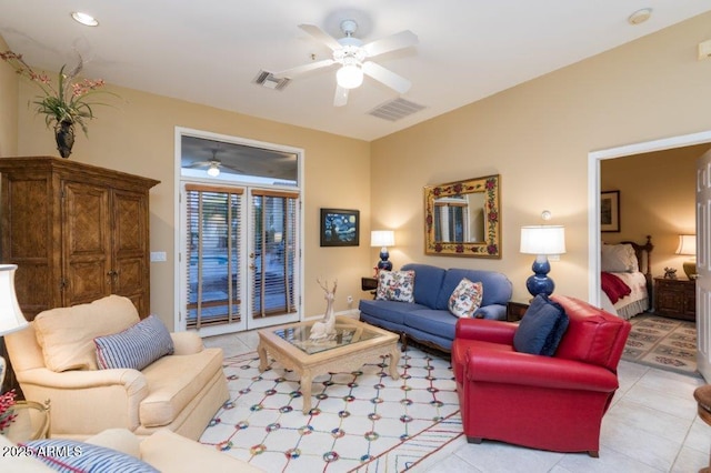 living area featuring light tile patterned floors, ceiling fan, and visible vents