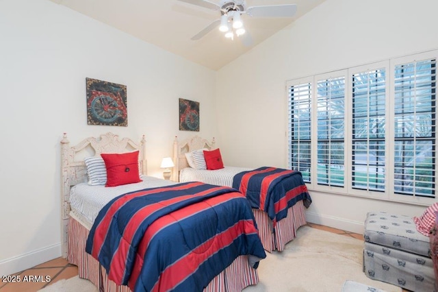 bedroom featuring lofted ceiling, ceiling fan, and baseboards