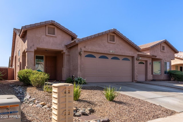 16818 S 23rd St, Phoenix, AZ 85048 - view of front of home with a garage, driveway, and stucco siding