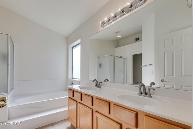 bathroom featuring separate shower and tub, tile patterned flooring, and vanity