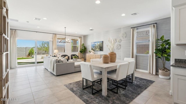 dining area with wallpapered walls, an inviting chandelier, visible vents, and recessed lighting