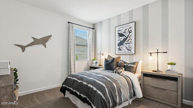 carpeted bedroom featuring baseboards