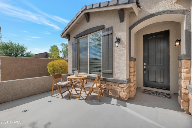 entrance to property with a patio area