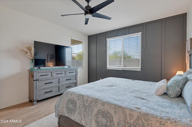 bedroom featuring light wood-type flooring and ceiling fan