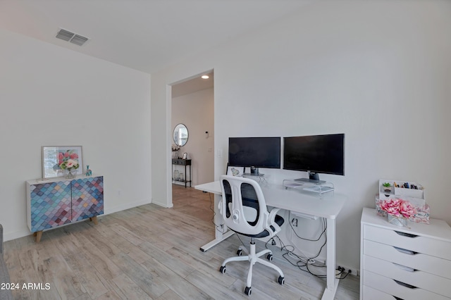 home office with light wood-type flooring