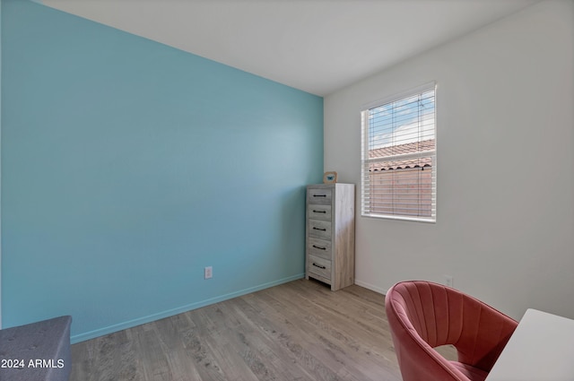 office with light hardwood / wood-style floors