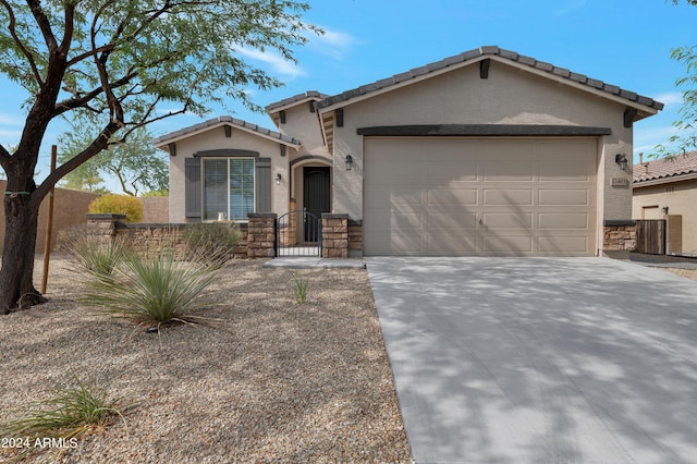 view of front of home featuring a garage and cooling unit