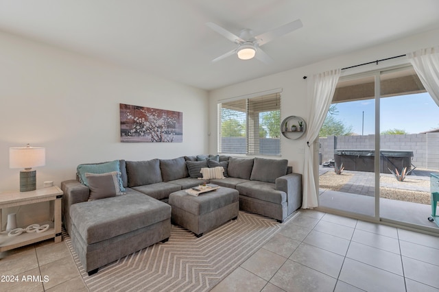 living room with light tile patterned floors and ceiling fan